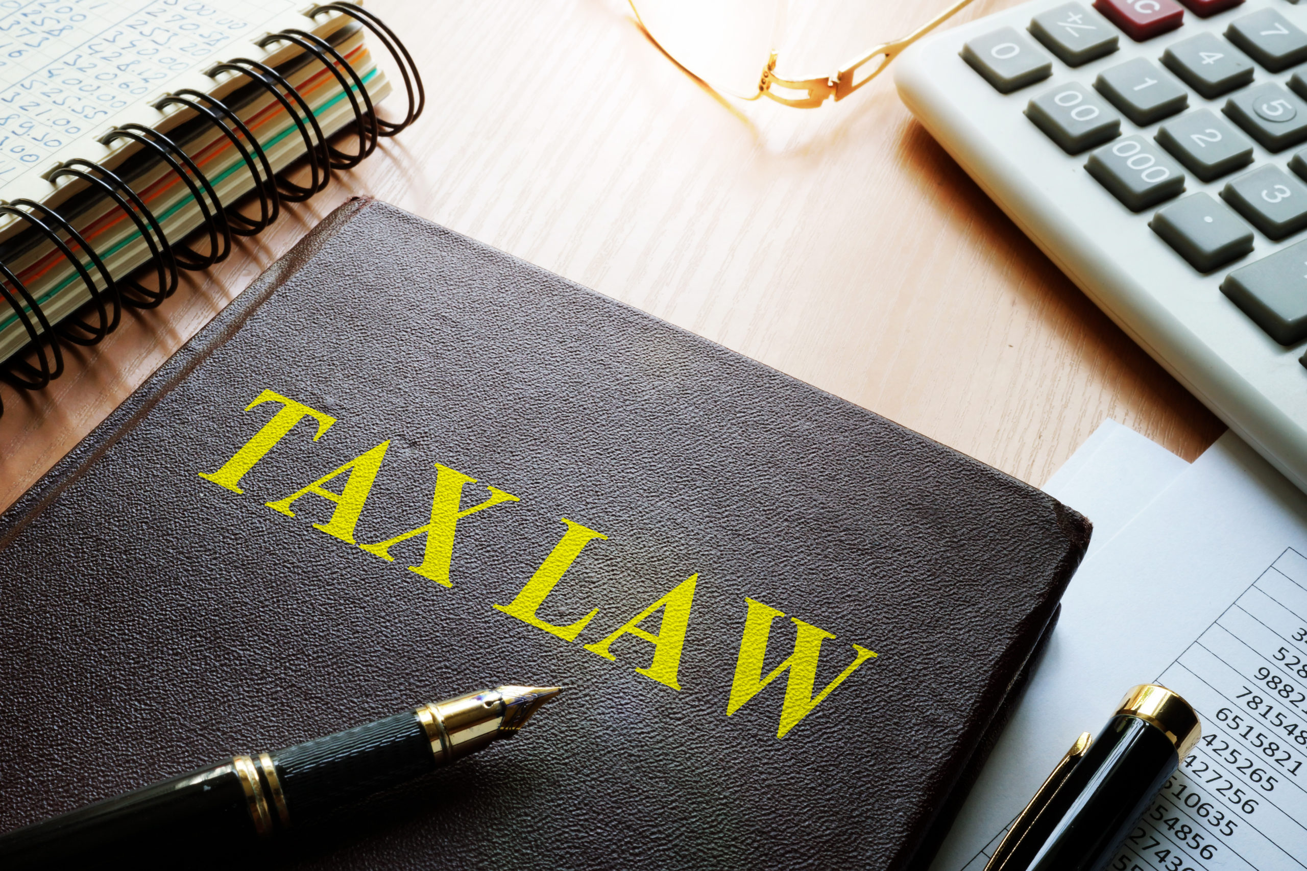 Notebook with "Tax Law" on a desk