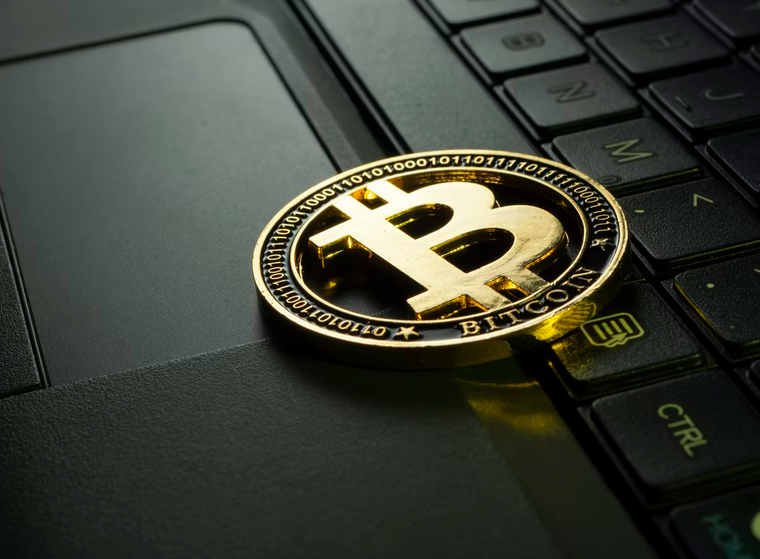 image of a bitcoin on a keyboard
